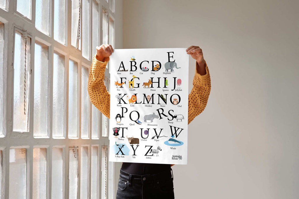 Person holding animal alphabet educational poster print